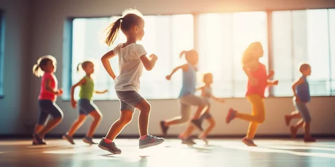 Fotobehang Motion blur of kids exercising in fitness studio, concept of Dynamic movement © koldunova
