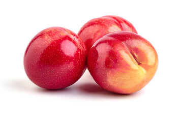 Red plum fruits, isolated on white background.