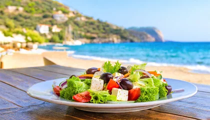 Zelfklevend Fotobehang Greek salad with vegetables at beach restaurant © Paula