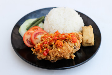 Ayam Geprek Indonesian Food crispy fried chicken with hot and spicy sambal Chili Sauce Served Steam Rice recipe.Currently ayam geprek found in Indonesia and neighbouring countries, Origin Yogyakarta