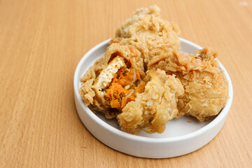 Fried tofu with spicy chiken filling. Often referred to as Tahu Mercon. Because it is deep fried, this tofu is also called Tahu Krispi. Traditional food from Indonesia which is crunchy and savory.