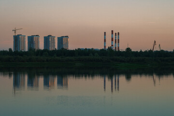 Fototapeta na wymiar Tyumen sunset cityscape (New residential buildings and power station)