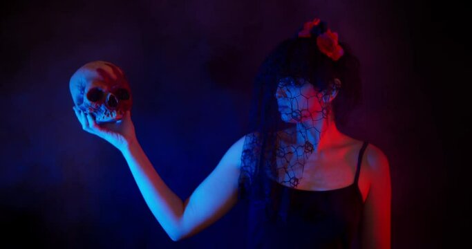 Woman Holding A Creepy Halloween Skull