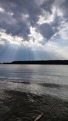 Sun rays on the river bank