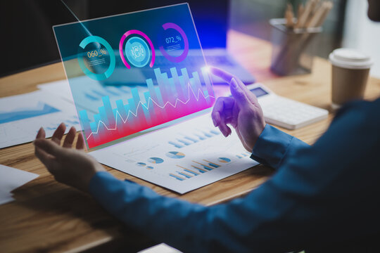 Technology and financial advisory services concept. Business woman hands working on digital tablet computer with advisor showing plan of investment to clients at table office. Digital marketing.