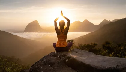 Foto op Plexiglas girl practicing yoga on a rock in mountain © Paula