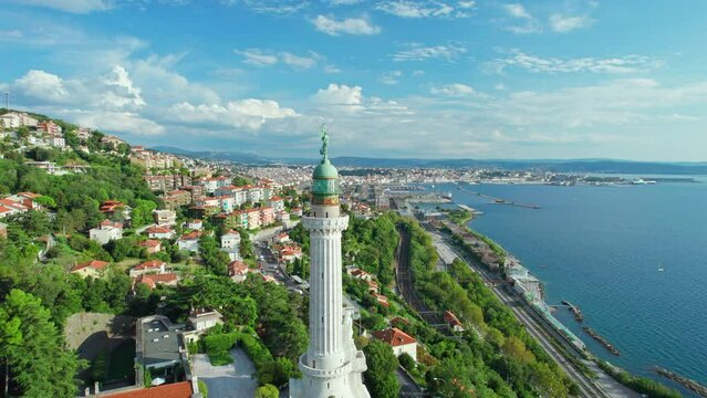 Faro della Vittoria lighthouse in Trieste city at sunny day, Italy
