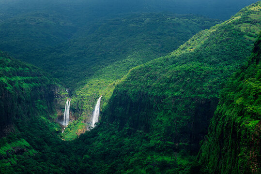 Beautiful and colorful waterfall, rainy season, light and shadows at Varandh Ghat, Bhor, Pune, Maharashtra, India.