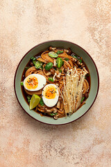 soba, buckwheat noodles, with enoki mushrooms, shimeji and boiled egg, top view, homemade, no people,