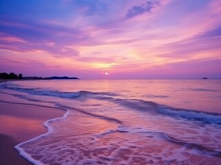 Summer beach with blue water and purple sky at the sunset.