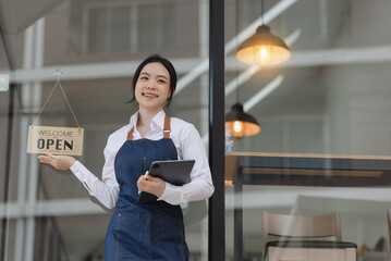 Happy smelling Asian woman owner with open sign broad and ready to service, Small startup business concept.