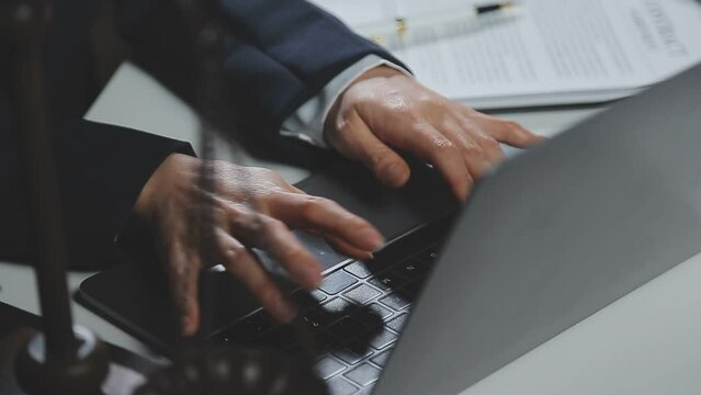 Business and lawyers discussing contract papers with brass scale on desk in office. Law, legal services, advice, justice and law concept picture with film grain effect