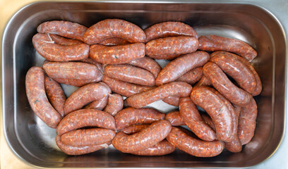 Freshly made Nduja sausage in the stainless still try