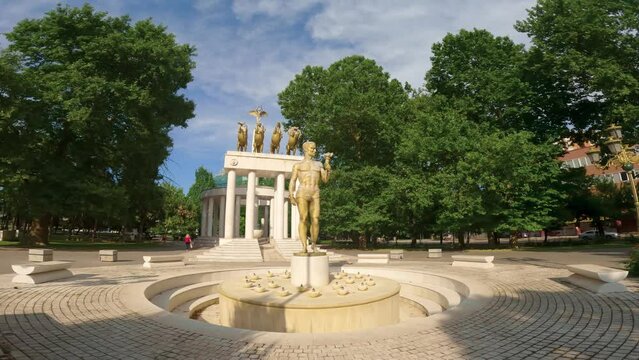 Monument to Fallen Heroes at historical (Zena Park) park of warriors. With a statue of Prometheus in the foreground