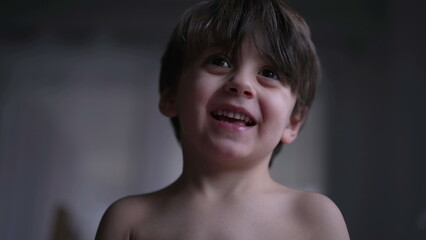 Portrait of a young boy closeup face. One male child with happy expression