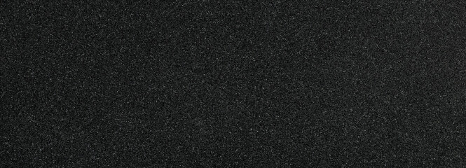 Background filled with black particles.	
