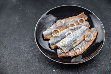 herring fillet fish fresh salted tasty seafood eating cooking meal food snack on the table copy...