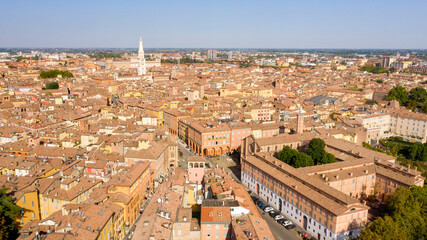 Fototapeta na wymiar Aerial view on the historic center of Modena, Italy. The Ghirlandina tower and the Duomo, the main church of the city, are in center of the Old Town.