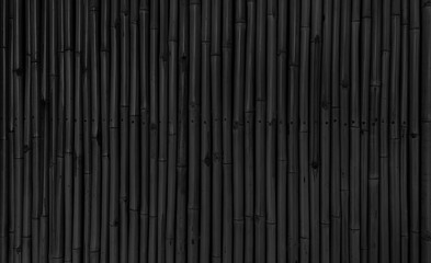 architectural dark black bamboo wall for japanese mood decoration, interior or exterior design. black bamboo plank fence texture used as background with blank space for design. - obrazy, fototapety, plakaty