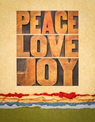 peace, love and joy typography  abstract in letterpress wood type on art paper - Merry Christmas concept