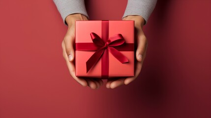 Man hands holding gift cardboard red box with red ribbon on crimson background. Christmas gift. Generative AI.