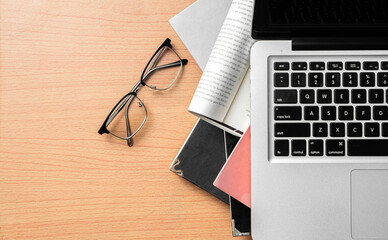 Creative Creativity Web Design desk with books, laptop and glasses on wooden background
