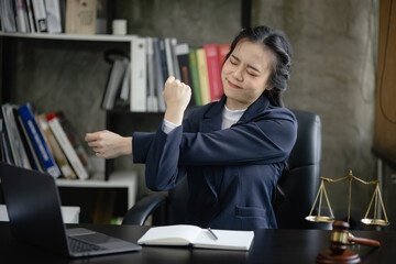 Lawyer woman stressed and tired from work in a courtroom, legal services, justice and law concept.