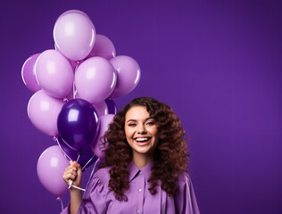 Horizontal shot of cheerful curly haired woman makes face palm dressed formally holds inflated balloons comes on graduation party celebrates her accomplishment isolated over purple background - obrazy, fototapety, plakaty
