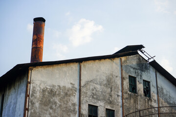 A very large old factory building to produce sugar cane or granulated sugar. Factory building built during the Dutch East Indies era in Rendeng, Kudus, Central Java, Indonesia