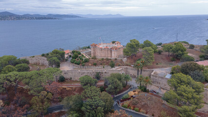 Fototapeta na wymiar Aerial view of the fort in Saint-Tropez. Photography was shot from a drone at a higher altitude with the bay in the background, on a cloudy day.