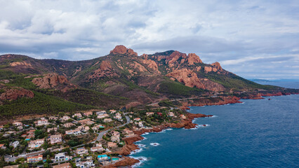 Fototapeta premium Aerial view of Rocher Saint-Barthélémy at French Riviera. In the photo can be seen the beautiful Rocher Saint-Barthélémy and the coast, shoot from a drone at a higher altitude.