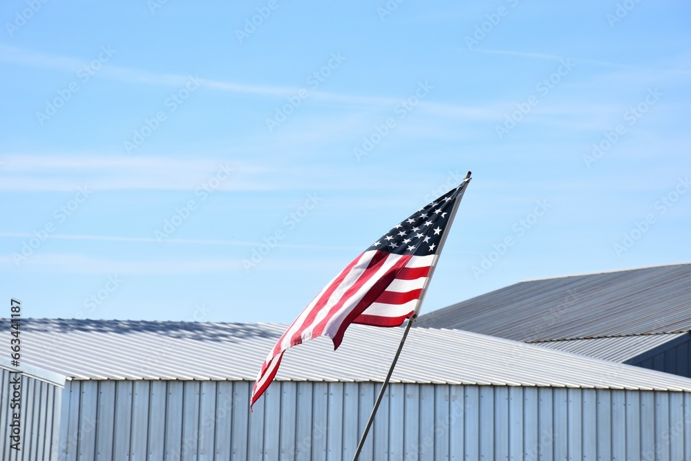 Sticker american flag by a metal barn