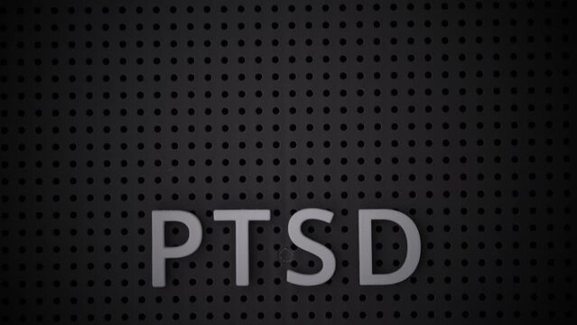 Word PTSD spelled out with white letters on a gray pegboard