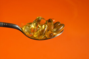 fish oil in capsules, omega-3. vitamin supplements. human health. background for the design