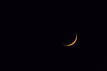 Moon wedge in the night sky - 663463552