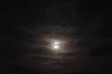 Beautiful cloudy and gloomy sky with shining moon - 663463591