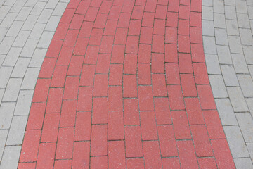 View of texture of red and gray paving stones of Miami Beach Walking Street along Atlantic Ocean...