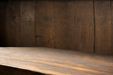 Red wine bottle and wine glass on wodden barrel. Beautiful Tuscany background. High quality photo