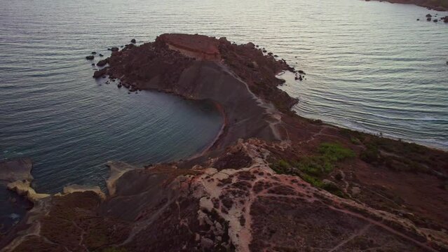 Aerial view of The Fourteen Soldiers Geological formation in Qarraba Bay, Mgarr, Malta.