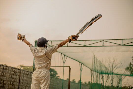 Cricket player celebrating his success after a match during his practicing time - Powered by Adobe