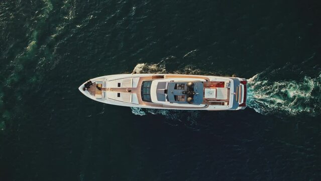 La Valletta, Malta - 04 July 2023: Aerial view of a yacht sailing off the coast in Malta.