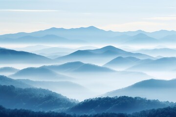 Fototapeta na wymiar Layered mountain ranges softened by early morning fog