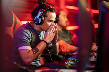 Young professional gamer experiencing defeat at the esport tournament venue