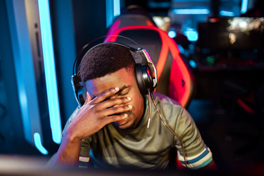 Young professional gamer experiencing defeat at the esport tournament venue