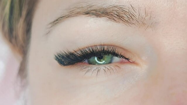 Close up of eye with eyelash extensions ,beauty salon treatment ,2d volume, 3d volume, classical lashes,Russian volume,megavolume, new set
