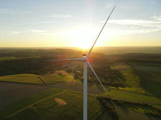Wind turbine on a sunny evening in the landscape 