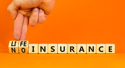 Life or no insurance symbol. Concept words Life insurance No insurance on wooden blocks. Beautiful orange table orange background. Businessman hand. Business Life or no insurance concept. Copy space.
