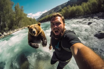 Deurstickers Man running away from scary bear across the river © spyrakot