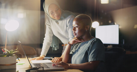 Office night diversity, laptop and happy woman review social network feedback, customer experience...
