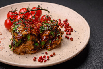 Delicious juicy fried chicken in teriyaki sauce with salt, spices, herbs and sesame seeds